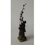 An early 20th century French spelter figure group of fruit pickers on a marble base titled La Courte
