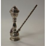 An Indian white metal hookah pipe, having floral embossed decoration, h.24cm