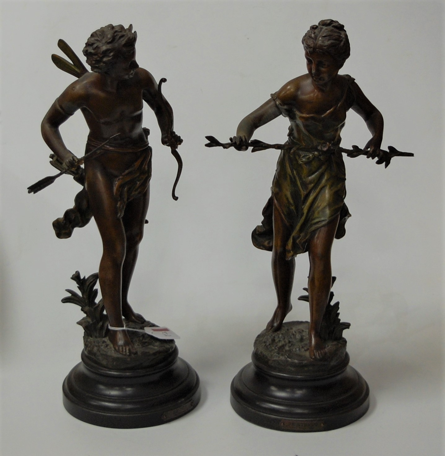 After Rancoulet, pair of French spelter figures, each in standing pose on wooden socle base