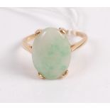 A 14ct gold and cabochon spinach jade set dress ring, the jade stone measuring approx 17x11x4mm, 5.