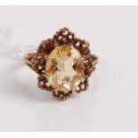 A modern 9ct gold and citrine set dress ring, the claw set oval cut citrine measuring approx 12.5