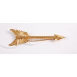 A Victorian silver gilt arrow brooch with safety chain, maker H&T 10cm
