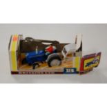 A boxed Britains Ford tractor with cab (box very poor)