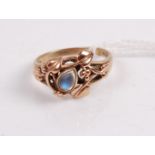 A 9ct gold moonstone set dress ring, the cabochon moonstone in a stylised surround of leaves and