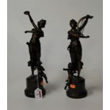 A pair of reproduction bronze figures of female musicians each in standing pose with instrument in