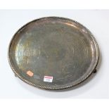 A Victorian silver plated drinks tray, of circular form within ropetwist border, with floral