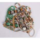A box of assorted costume jewellery, to include white metal mounted brooch, bangle, beaded necklaces