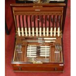 A mahogany cased twelve place setting canteen of silver plated cutlery, in the Rat-tail pattern (