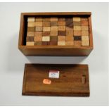 A boxed African Takoradi wooden block game