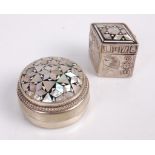An Egyptian silver and mother of pearl pill-box, of lozenge shape, decorated with hieroglyphics; and