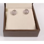 A pair of contemporary 9ct white gold and diamond set ear studs, dia. 7mm, in Goldsmiths retail box