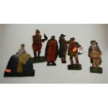 A set of six early 20th century polychrome painted plywood theatre figures, each in the form of a