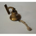 A modern brass wall mounted bell