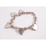 A Tiffany & Co. silver bracelet having heart shaped stamped pendants