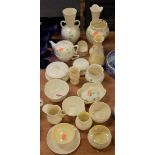 A large collection of modern Belleek to include teapot and cover, trinket jar and cover, vases, jugs