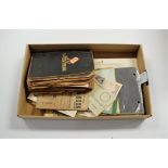 A collection of assorted photographs and ephemera, to include 1945 dated ration book, clothing