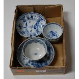 A pair of early 19th century blue and white tea bowls and saucers, each of scalloped circular form
