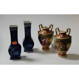 A pair of Vienna porcelain twin handled vases, of baluster form, each decorated with a lady
