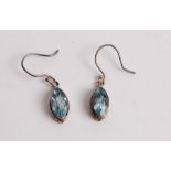A pair of blue topaz and silver mounted ear pendants, on shepherd crook fittings, blue topaz