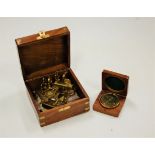 A reproduction miniature brass sextant in brass bound box, together with a small brass compass (2)