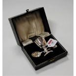 An Elizabeth II silver christening set to include egg cup and spoon in fitted leather case