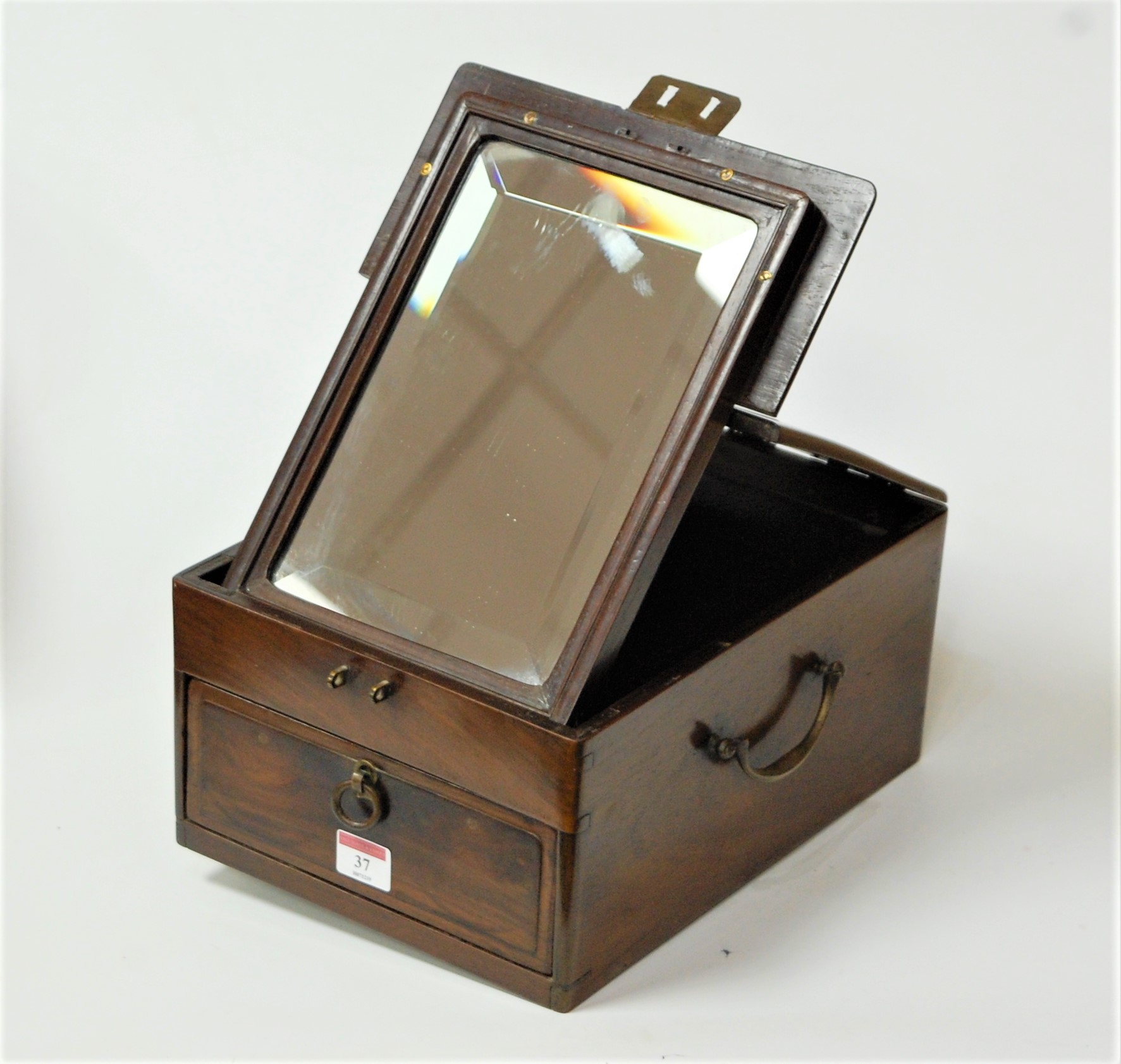 A mahogany and brass mounted travel case, the hinged lid with folding mirror and single drawer below