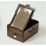 A mahogany and brass mounted travel case, the hinged lid with folding mirror and single drawer below