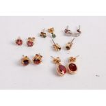 A collection of various yellow and white metal semi-precious set ear studs, to include garnet,