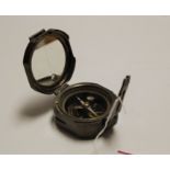 A reproduction pocket compass, stamped Stanley of London