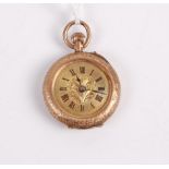 A ladies 9ct gold and floral enamel inset open face fob watch, having finely engraved case,