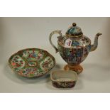A late 19th century Chinese Canton Famille Rose teapot and cover typically decorated with various