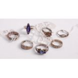 A collection of silver, semi-precious and paste set dress rings, to include amethyst example