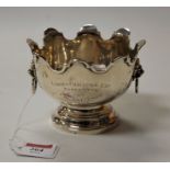 A George V silver presentation rosebowl having a shaped rim with lion mask handles, height 9cm