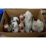 A collection of 20th Century Staffordshire pottery spaniels