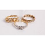 A 9ct gold diamond highlight set eternity ring, size L; an 18ct gold and diamond five stone ring;