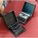 A Remington travel typewriter, together with another similar, both cased