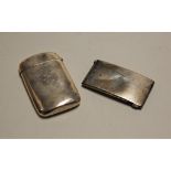 A Victorian silver visiting card case, of plain rectangular form with monogram; together with a