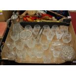 A box containing a collection of cut and pressed glassware to include a claret jug