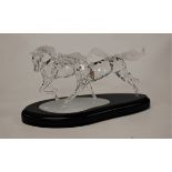 A Swarovski silver crystal figure group of the Wild Horses with Certificate of Authenticity in a