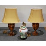 A pair of large modern toleware style table lamps each in the form of an urn, having silk shade,