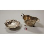 A late Victorian silver scallop shaped butter dish, London 1899, together with a George V silver