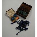 An early 20th century lady's white metal and blue enamel set necklace; together with a scarab beetle