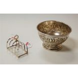 An Art Nouveau silver pedestal bowl, repousee decorated with flowers; together with a George V