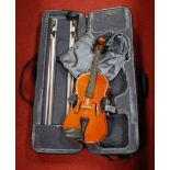 A Stentor Conservatoire student's violin in case, with two bows