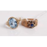 A modern 9ct gold, blue and white sapphire set flower head cluster ring, on textured band, size M;