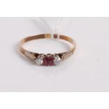 A 9ct gold, ruby and diamond three stone ring, 1.7g, size S