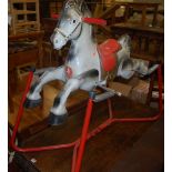 A Prairie King painted pressed metal child's sprung rocking horse