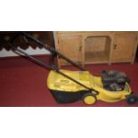 A Briggs & Stratton McCulloch Lawnmac ML433 petrol driven lawn mower, with grass collecting box