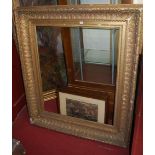 A large 19th century giltwood and gesso rectangular picture frame, having raised acanthus outer
