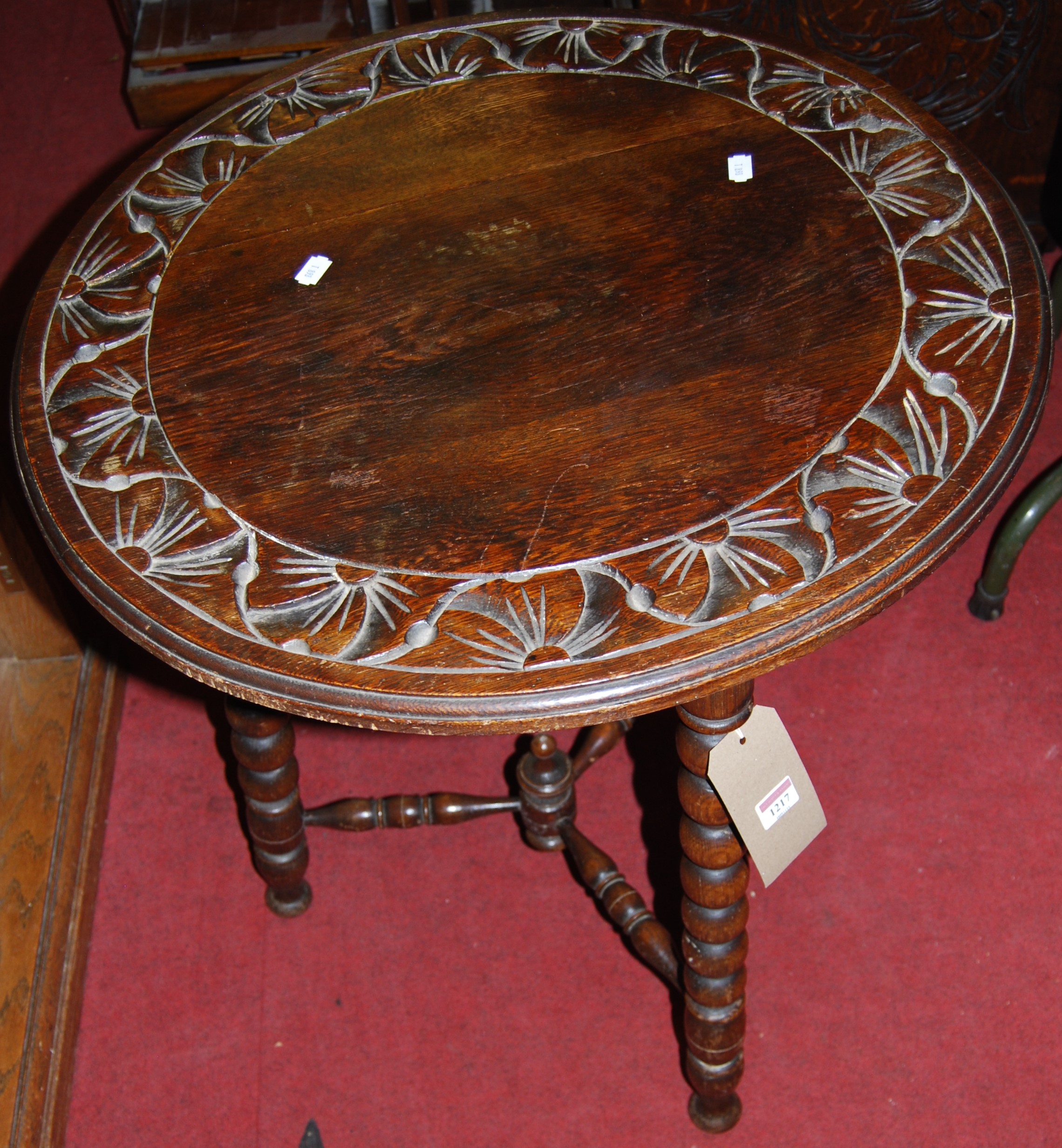 An early 20th century relief carved oak circular bobbin turned pub table, dia. 61cm